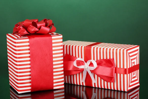 Colorful red gifts on green background — Stock Photo, Image