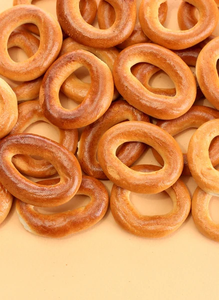 Tasty bagels, on beige background — Stock Photo, Image