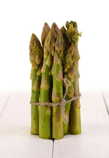 Useful asparagus on wooden table on white background — Stock Photo, Image