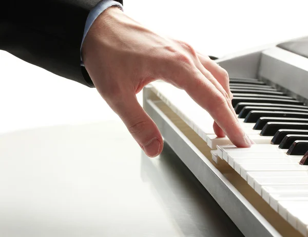 Hand of man playing piano — Stock Photo, Image