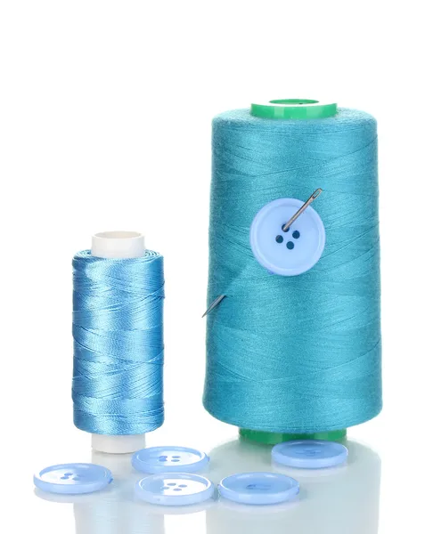 Blue bobbin with needle and buttons isolated on white — Stock Photo, Image