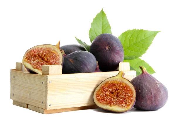 Ripe sweet figs with leaves in wooden crate isolated on white — Stock Photo, Image