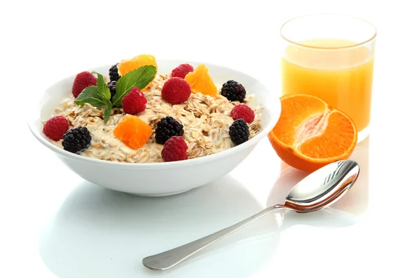 Tasty oatmeal with berries and glass of juice, isolated on white — Stock Photo, Image