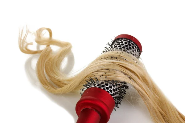 Blond curls brushing comb isolated on white — Stock Photo, Image