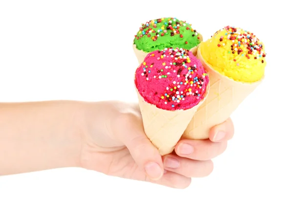 Three scoops of lemon, strawberry and kiwi ice cream in the waffle cones decorated with sprinkles — Stock Photo, Image