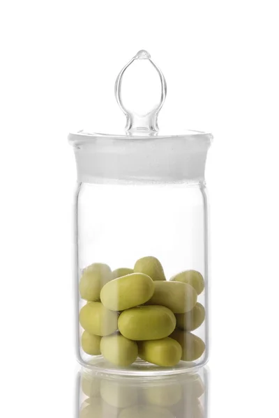 Transparent bottle with pills isolated on white — Stock Photo, Image