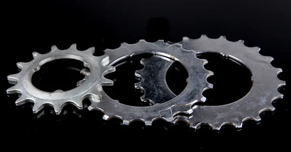 Metal cogwheels on black background — Stock Photo, Image