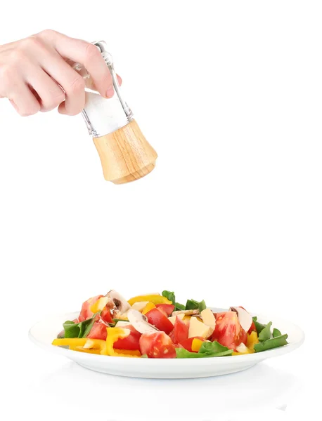 Hand toe te voegen zout met behulp van zout shaker geïsoleerd op wit — Stockfoto