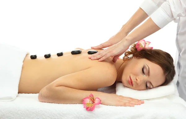 Beautiful young woman in spa salon getting massage with spa stones — Stock Photo, Image