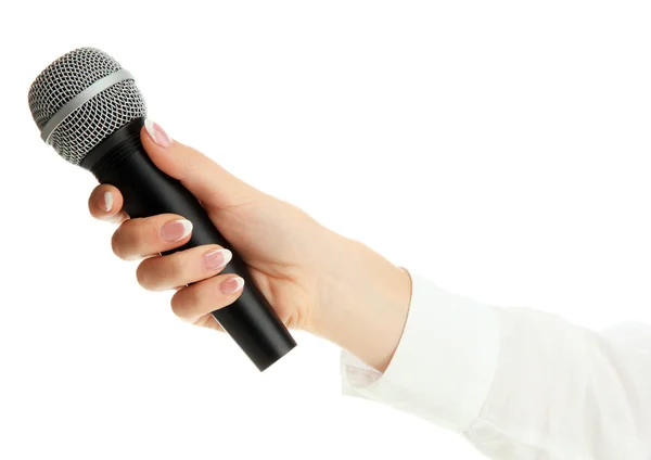 El ile üzerine beyaz izole mikrofon — Stok fotoğraf