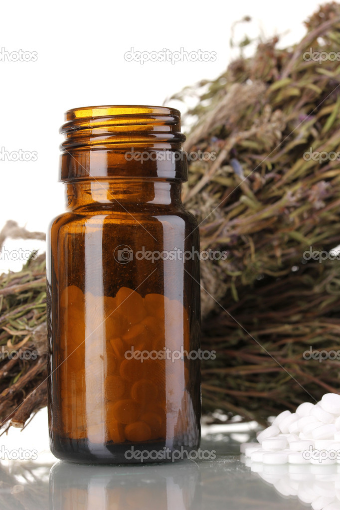 bottle of medicines with herbs on white background. concept of homeopathy