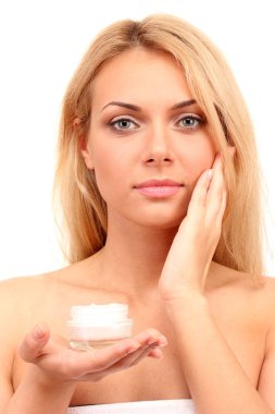 güzel bir genç kadın üzerinde beyaz arka plan yakın çekim kremalı bir kavanoz ile