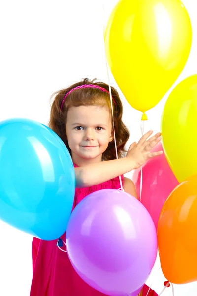 Красивая маленькая девочка с шариками, изолированными на белом — стоковое фото