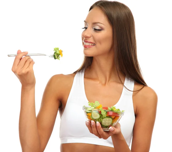 Mooie jonge vrouw met salade, geïsoleerd op wit — Stockfoto