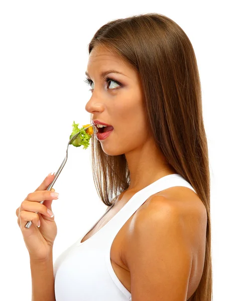 Schöne junge Frau mit Salat auf Gabel, isoliert auf weiß — Stockfoto