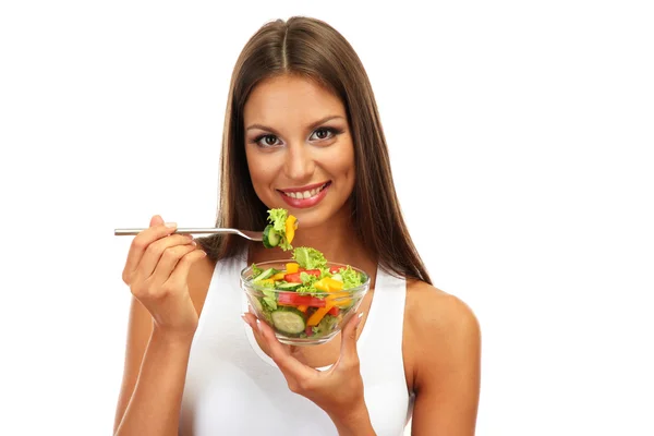 Mooie jonge vrouw met salade, geïsoleerd op wit — Stockfoto