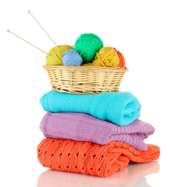 Sweaters and balls of wool isolated on white — Stock Photo, Image