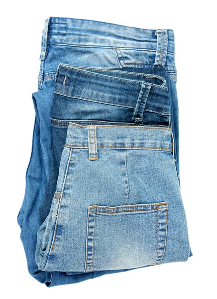Několik módní modré džíny izolované na bílém — Stock fotografie