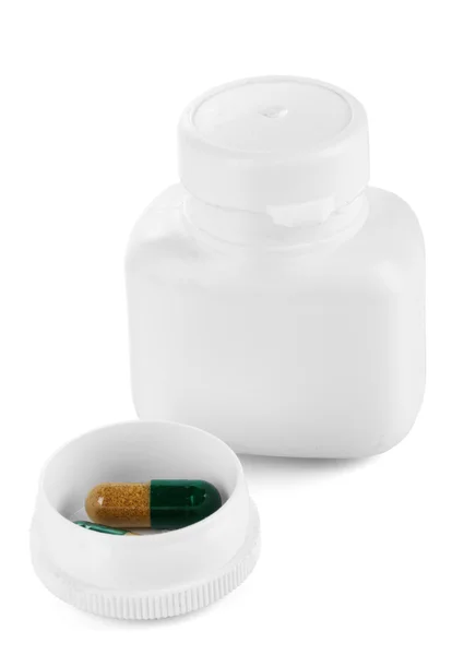 Dispenser per compresse con flacone con pillole isolate su bianco — Foto Stock
