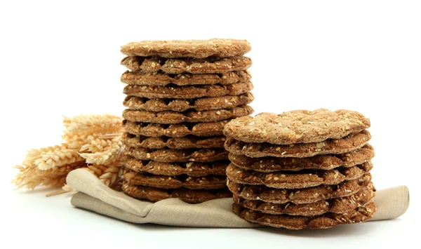 Smakelijke knäckebröd en oren, geïsoleerd op wit — Stockfoto