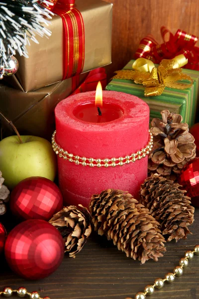 Composition from Christmas decorations close-up on wooden table on wooden background — Stock Photo, Image