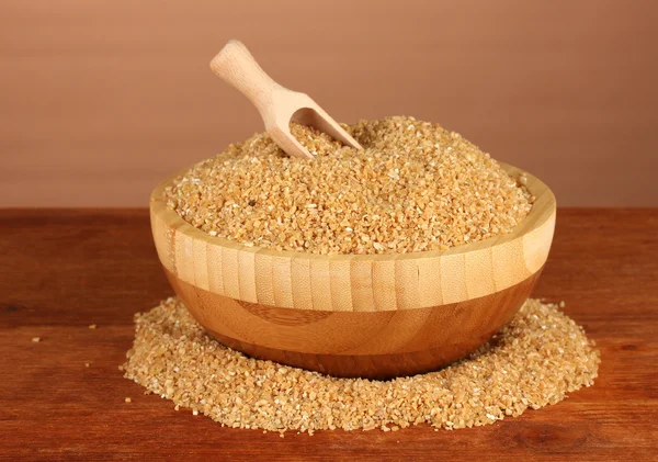 Arnautka in wooden bowl on brown background close-up — Stock Photo, Image