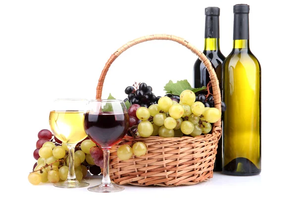 Bottles and glasses of wine and grapes in basket, isolated on white — Stock Photo, Image