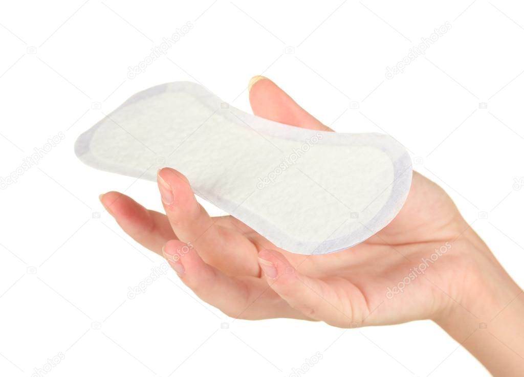 woman's hand holding a daily sanitary pad on white background close-up