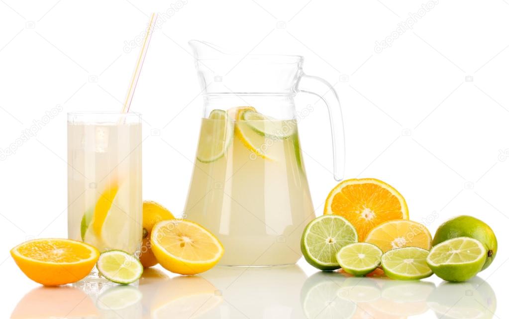 Citrus lemonade in pitcher and glass of citrus around isolated on white