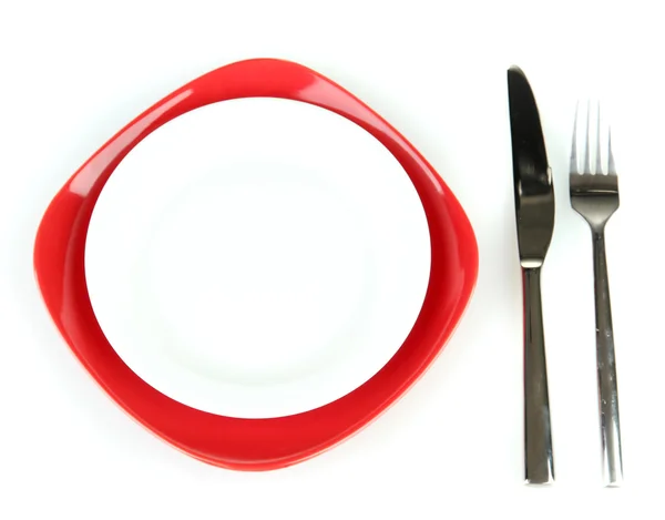 Empty red and white plates with fork and knife isolated on white — Stock Photo, Image