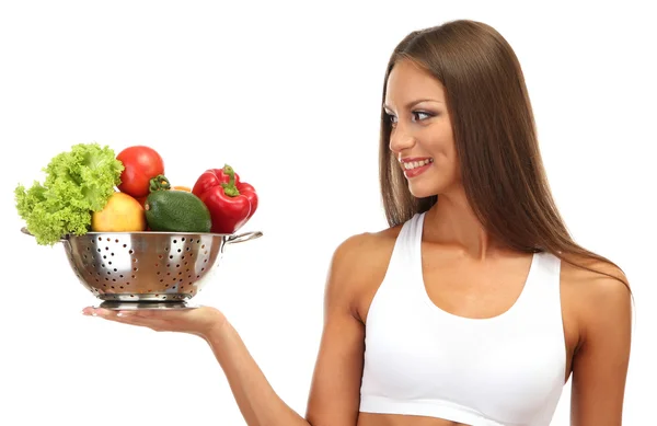 Hermosa mujer joven con verduras en colador, aislado en blanco — Foto de Stock