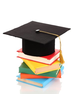 grad şapka ile üzerine beyaz izole kitap