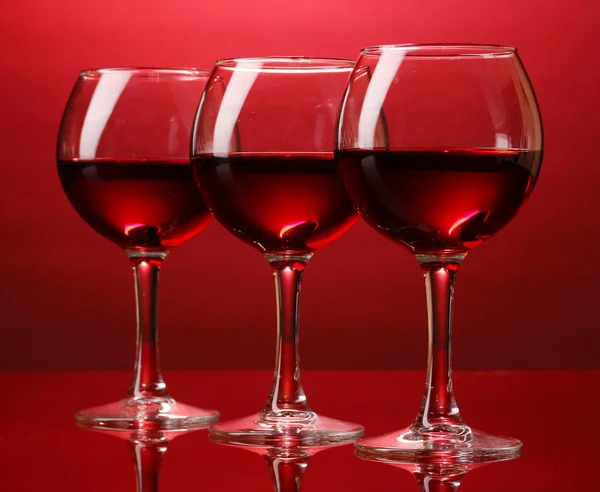 Wineglasses on red background — Stock Photo, Image