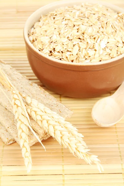 Brown bowl full of oat flakes — Stock Photo, Image