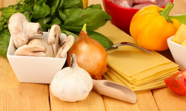 Vegetarian lasagna ingredients on wooden background — Stock Photo, Image