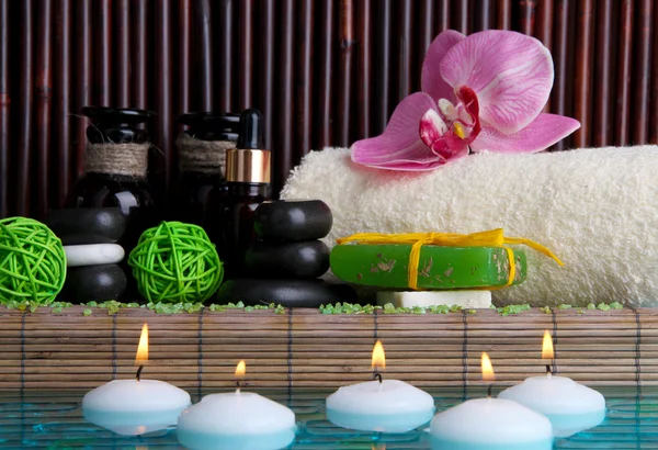 Beautiful spa setting near pool on bamboo background — Stock Photo, Image