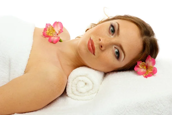 Beautiful young woman in spa salon, isolated on white — Stock Photo, Image