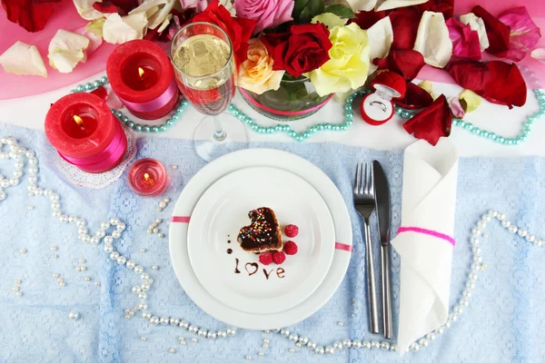 Table setting in honor of Valentine's Day close-up Stock Photo