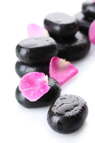 Spa stones with drops and rose petals isolated on white — Stock Photo, Image