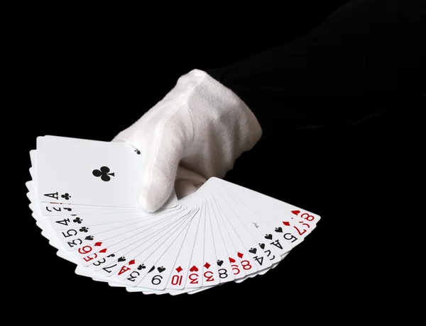 Cards in hand isolated on black — Stock Photo, Image