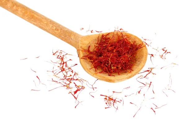 Stigmas of saffron in wooden spoon on white background close-up — Stock Photo, Image