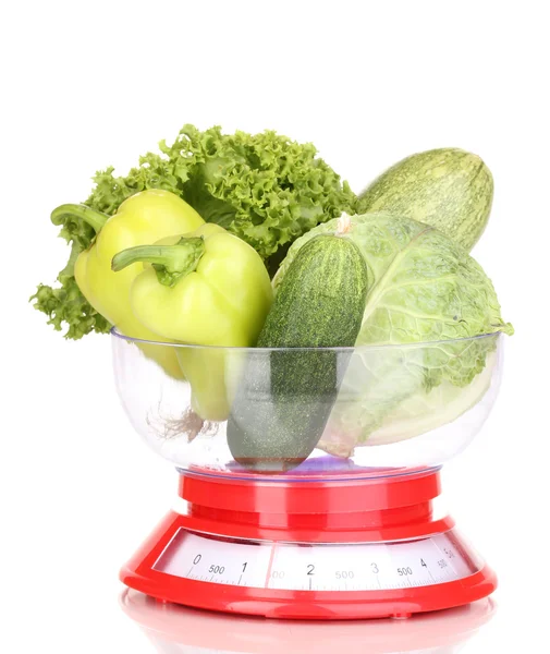 Fresh green vegetables in scales isolated on white — Stock Photo, Image