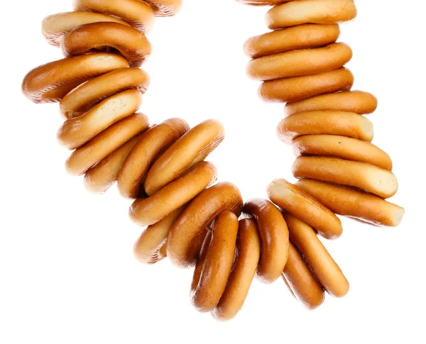 Bagels saborosos na corda, isolados no branco — Fotografia de Stock