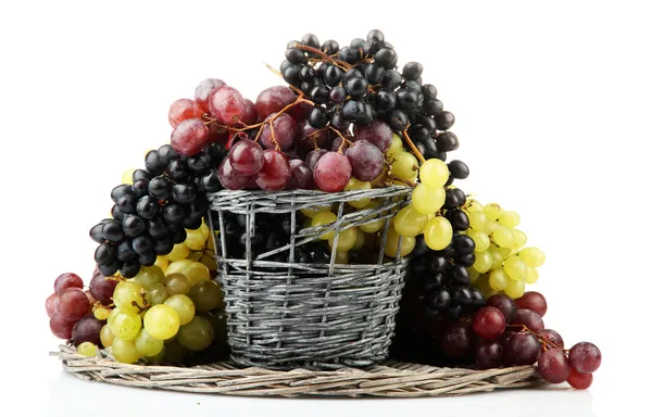 Assortment of ripe sweet grapes in basket, isolated on white — Stock Photo, Image