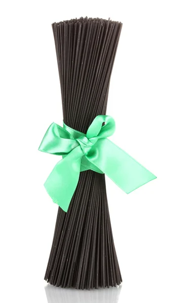 Black spaghetti with ribbon isolated on white — Stock Photo, Image
