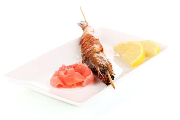 King prawn skewers on plate with ginger and lemon isolated on white — Stock Photo, Image