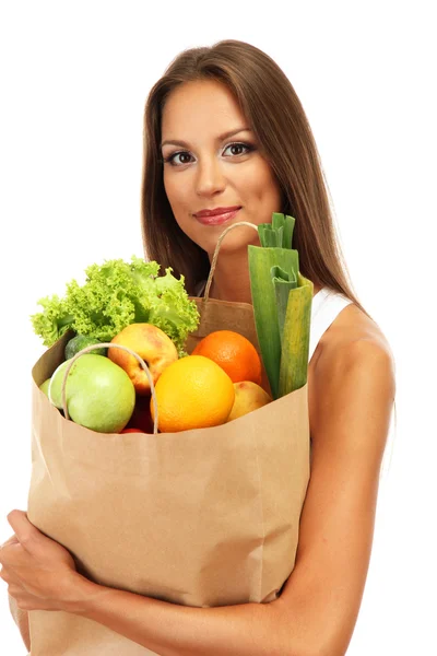 Mooie jonge vrouw met groenten en fruit in boodschappentas, geïsoleerd op wit — Stockfoto