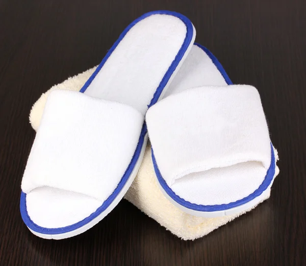 Slippers on wooden background — Stock Photo, Image