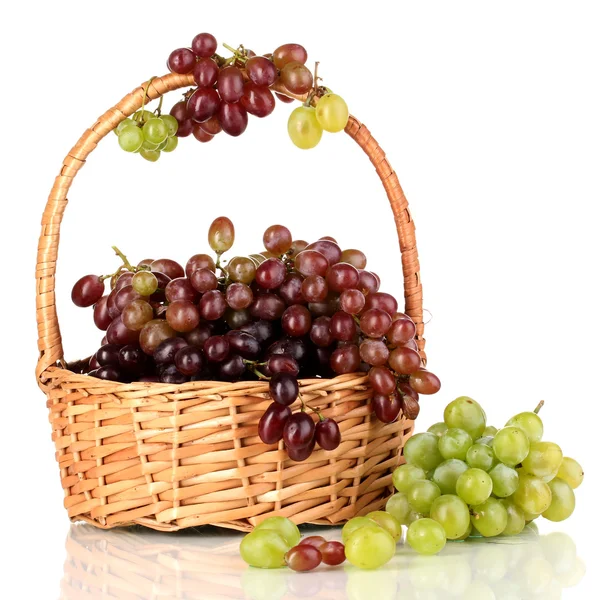 Delicious ripe pink and green grapes in basket isolated on white — Stock Photo, Image