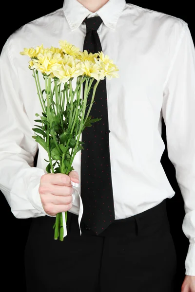 Man med blommor närbild — Stockfoto